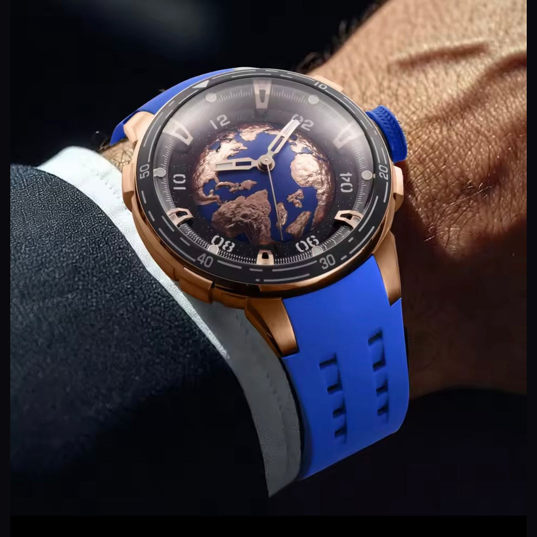 PINDU P6676 Planet Series watch worn on the wrist, blue strap and gold Earth dial