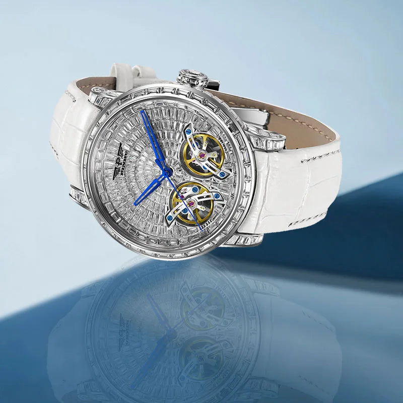PINDU P6656 silver diamond skeleton watch with white leather strap and blue hands on a blue background