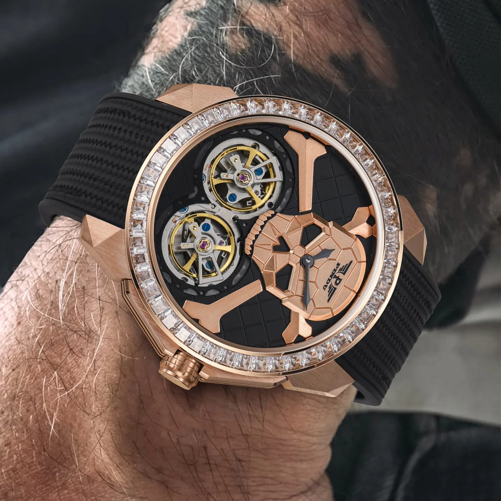 PINDU P6666 double flying wheel automatic watch close-up detail on wrist dual yellow tourbillon wheels ghost head dial rose gold case textured black rubber strap