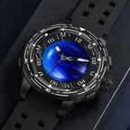 PINDU P6676 Planet Series Planet blue domed dial in black 48mm case, laid flat on navy suede with black silicone strap curled