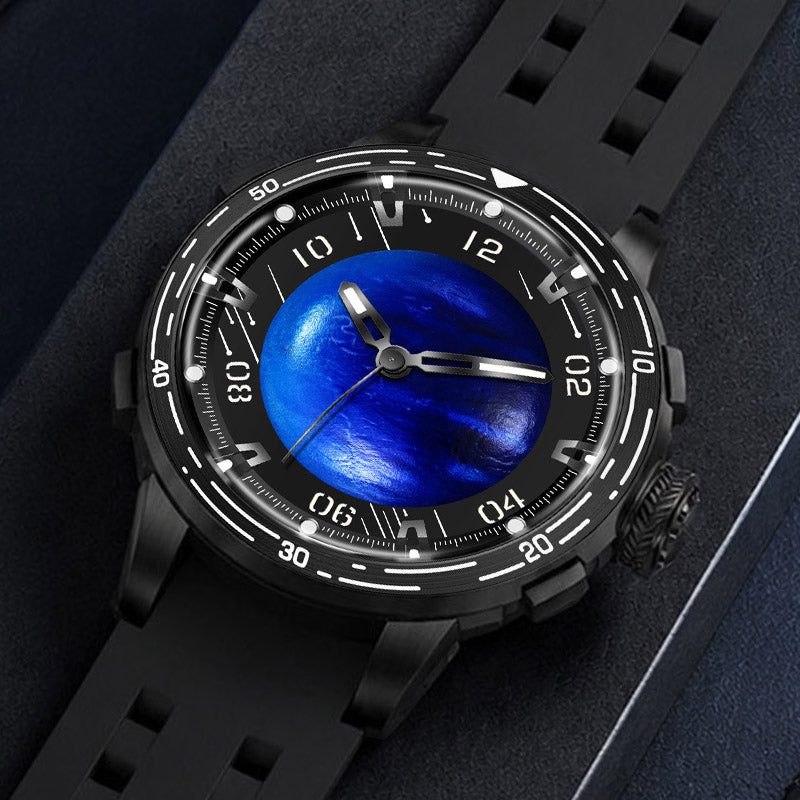 PINDU P6676 Planet Series Planet blue domed dial in black 48mm case, laid flat on navy suede with black silicone strap curled